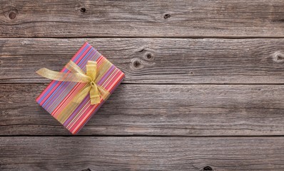 Gift on a wooden surface. There is a place for your text.