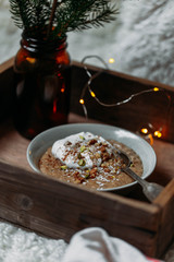 gluten-free oatmeal with berries and nuts and tender lactose-free vegetarian yogurt