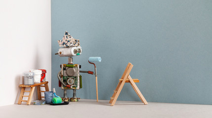 Decorator robot with paint roller and painter tools. Wooden ladder, paint buckets. Copy space
