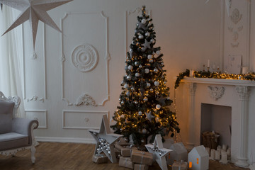 Interior living room with a Christmas tree and decorations.