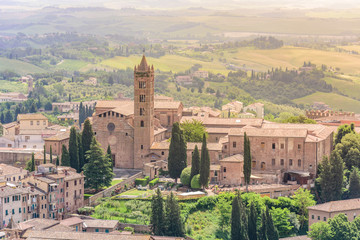 Fototapeta na wymiar Historic town Siena, Tuscany - Aerial view with beautiful landscape scenery on a sunny summer day, walled medieval hill town with towers in the province of Siena, Italy- Europe