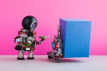 Robot courier moving big blue box container pushcart. Pink wall, gray floor background