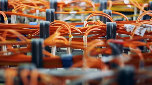 Special cables plugged to a computer at a data center. 4K.