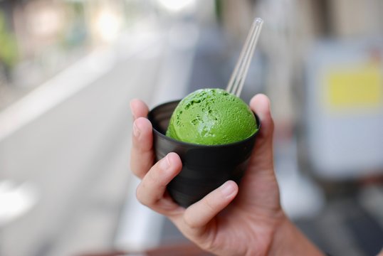 Matcah creamy green tea ice cream in the black cup ready to eat