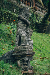 Closeup portrait of Hindu Buddhist traditional stone sculpture. Bali, Indonesia