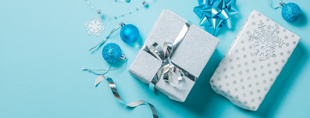 Christmas background - presents and decorations in silver and blue