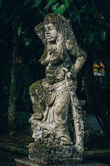 Fototapeta na wymiar Closeup portrait of Hindu Buddhist traditional stone sculpture. Bali, Indonesia