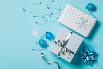 Christmas background - presents and decorations in silver and blue