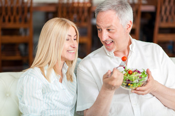Senior couple having a salad