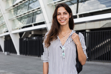 Fototapeta premium Excited attractive young woman in stylish trendy official wear enjoying morning break time in Europian country. Cheerful mood, true emotions, healthy lifestyle, smiling and confident