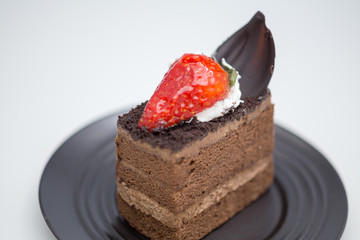 Slice of chocolate cake in saucer