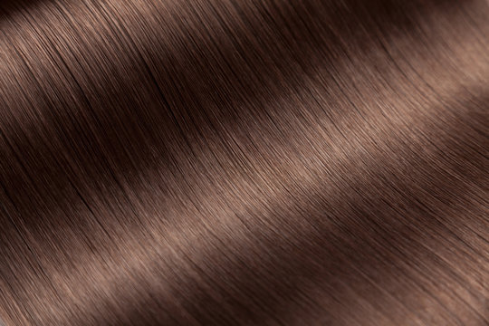 Closeup on luxurious glossy brown hair