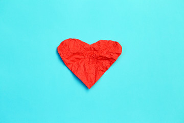 Red crumpled paper hearts on blue background, Valentines day