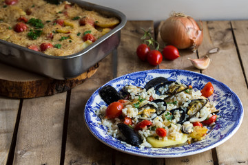 Rice, potatoes and mussels, traditional apulian dish, italian cuisine, Bari, on the wooden background