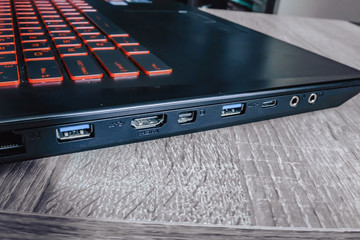 Notebook on red table with blank screen