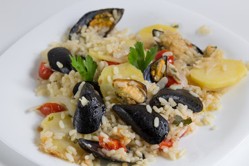 Rice, potatoes and mussels, traditional apulian dish, italian cuisine, Bari, close up