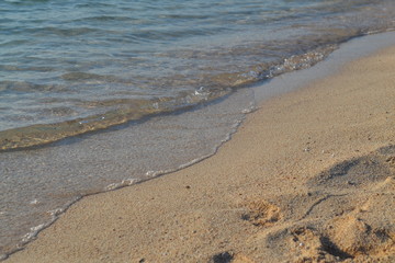 Fototapeta na wymiar Sea waves on the sand