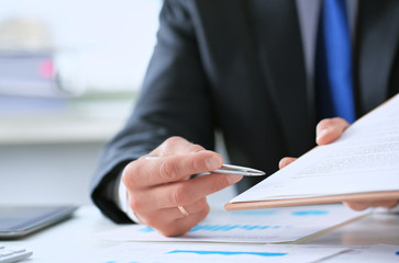 Businessman pointing the place where you have to to put the signature in new job employment contract
