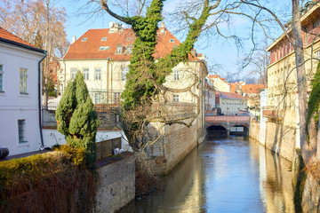 Fototapeta premium View of old Prague with canals and houses. Vacation travel destination