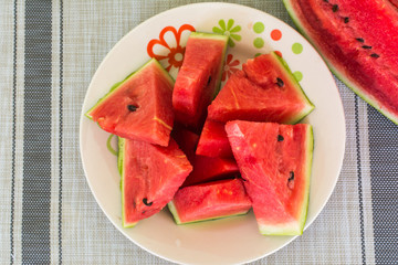 watermelon cut into fatis on table
