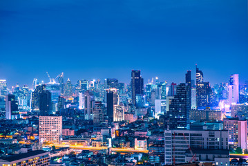 Beautiful Bangkok skyline at night blue hour in the city center business and travel place.