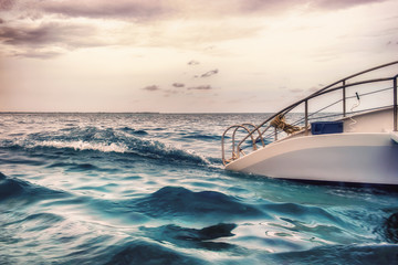 Close up of a part of a Catamaran sailing on the Caribbean Sea by Grand Cayman at sunset