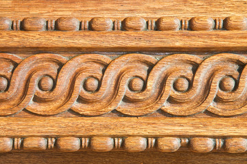 Old carved wooden frame with geometric and circular decorations shape