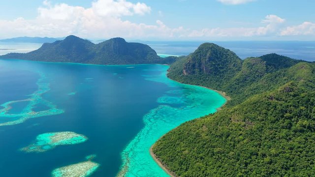 Aerial panoramic view of Pulau Bodgaya / Bohey Dulang Islands, turquoise crystal clear waters, beautiful lagoons and coral reefs of Celebes Sea - landscape panorama of Borneo, Malaysia, Pacific Ocean