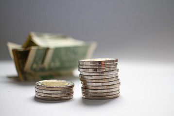 Close up coins for banking, economics, loan, finance, money. Pile of coins and us dollars. Change and bills. Money saving concept. Economy grow. Expensive life and poor people. Salary day. Copy space