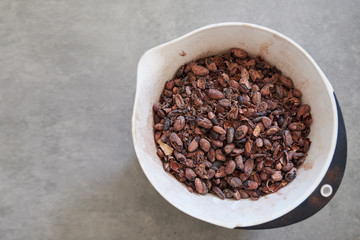 Cocoa beans being weighed in an artisanal chocolate making factory 
