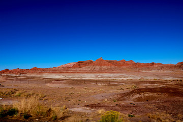 Fototapeta premium Boundless area desert. Red mountain. Red land. Arizona.