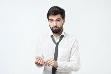 Handsome businessman prepare to wearing suit on white background