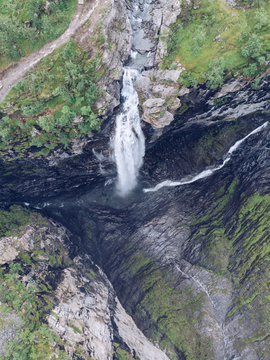 Bridge over ravine near waterfall