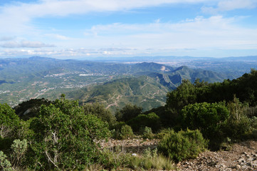 Green bushes and stones on the top of Montserrat mountains in Barcelona, Spain