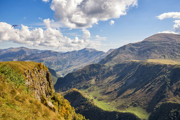 Caucasus mountain landscape with paragliders