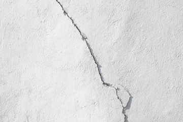 White wall with diagonal crack fracture texture close up detail surface