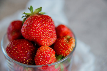A Cup with fresh ripe strawberries.
