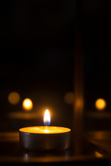 candle flames glowing in the dark