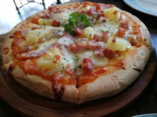 Pizza on the wooden plate