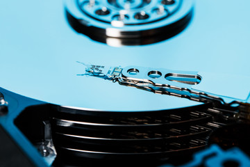 Disassembled hard drive from the computer, hdd with mirror effect. Opened hard drive from the...