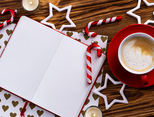 Top view blank notepad with christmas decor on wooden background.