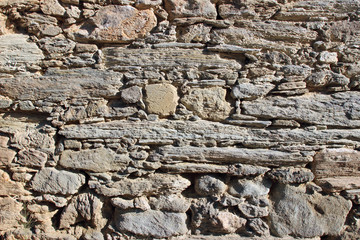 Old handmade stone wall masonry detail texture horizontal