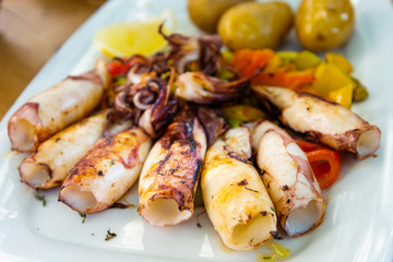 Mediterranean Octopus with vegetables and potatoes