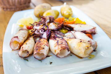 Mediterranean Octopus with vegetables and potatoes