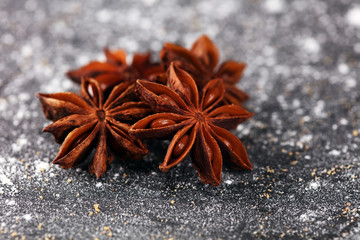 staranise winter spices on rustic background