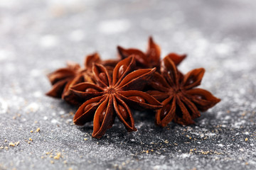 staranise winter spices on rustic background