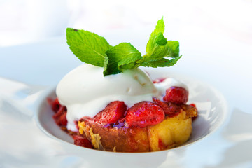 French toast grilled with strawberries and ice cream on top