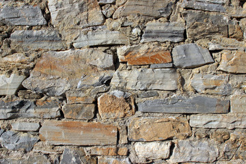 Old handmade stone wall masonry detail texture horizontal