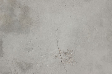 Concrete plaster cement wall with stains markings cracks detail close up