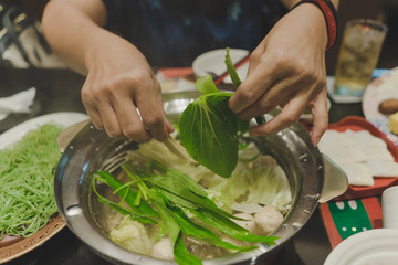  Sport women eats suki yaki after exercise